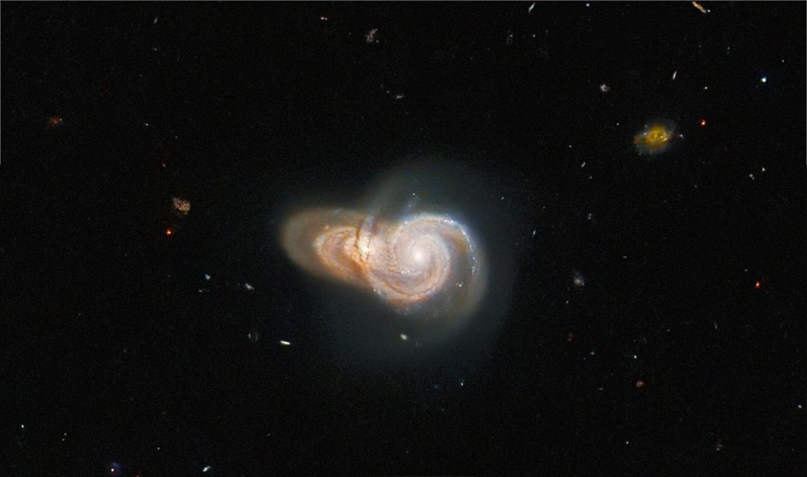 Hubble Telescope Snaps Enchanting Shot Of Two Galaxies Intertwined In Cosmic Embrace