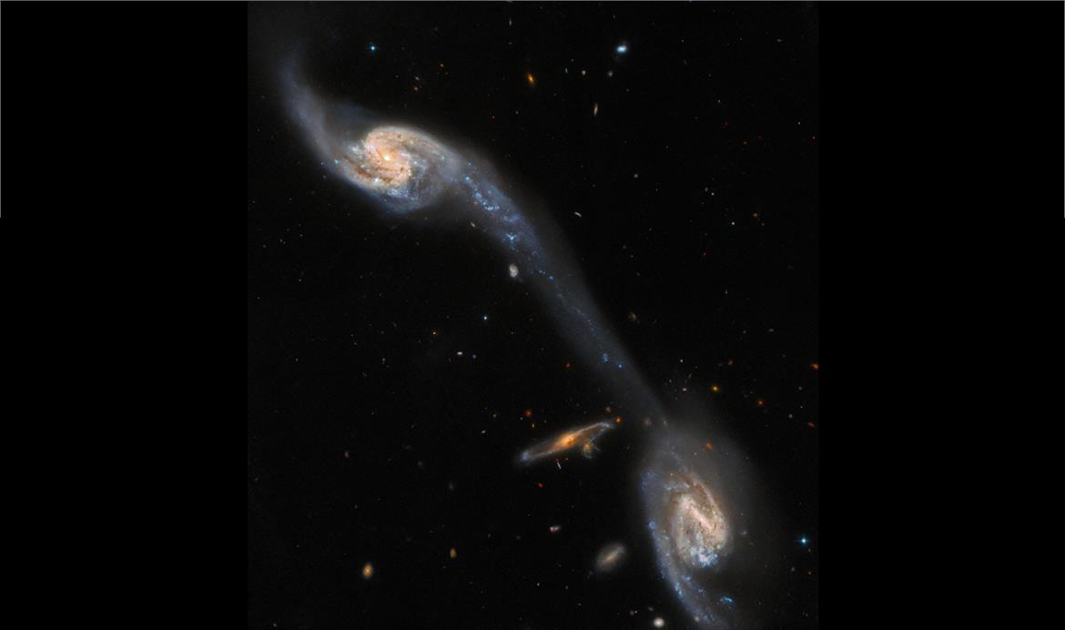 Hubble Shares Amazing Photo Of A Cosmic Bridge Linking Two Spiral Galaxies